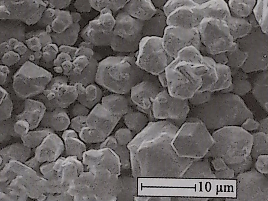 Figure 3.7 SEM image of typical chemically reduced tungsten powder (12.0 kV, 2000×). Figure 3.7 SEM image of typical chemically reduced tungsten powder (12.0 kV, 2000×).